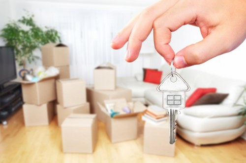 Removal team handling home moving boxes in Bermondsey