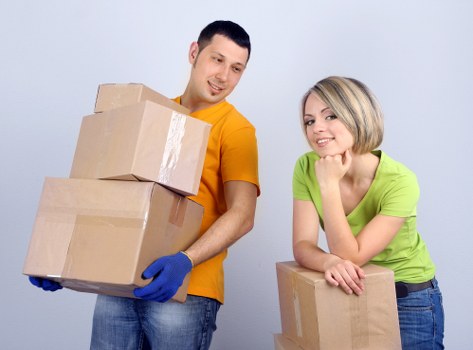 Flat removal service preparing furniture and boxes for transport in Bermondsey