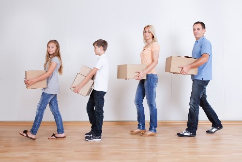 Packed moving boxes and furniture ready for transport in Bermondsey